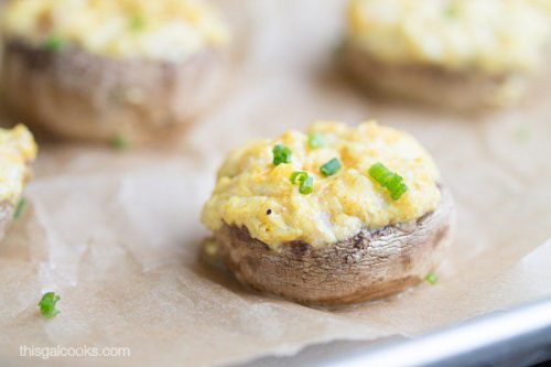 Picture of a Keto Curry Shrimp Stuffed Mushroom with a couple more faded in the background